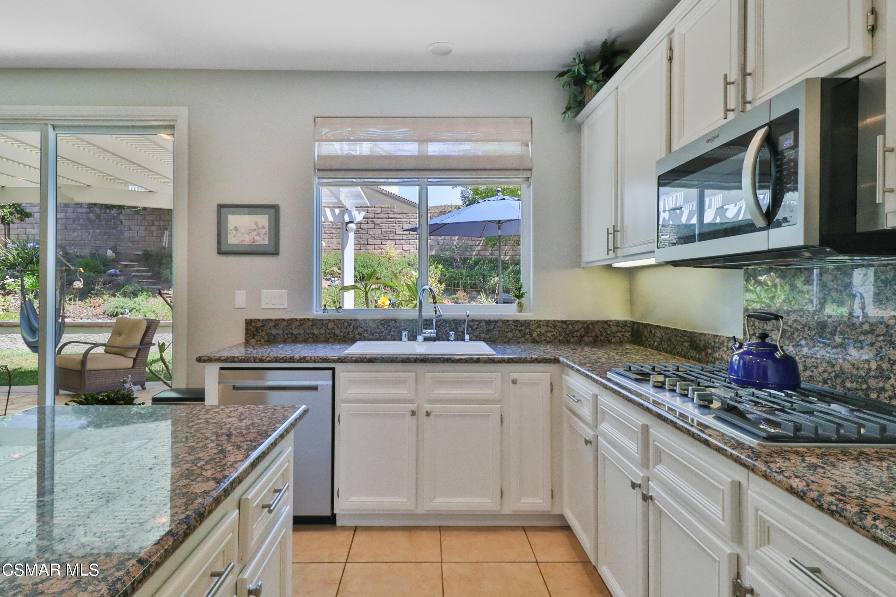 1419 Hidden Ranch Drive Simi Valley, CA 93063 - Photo 15 of 50 a kitchen with stainless steel appliances granite countertop a stove sink and cabinets