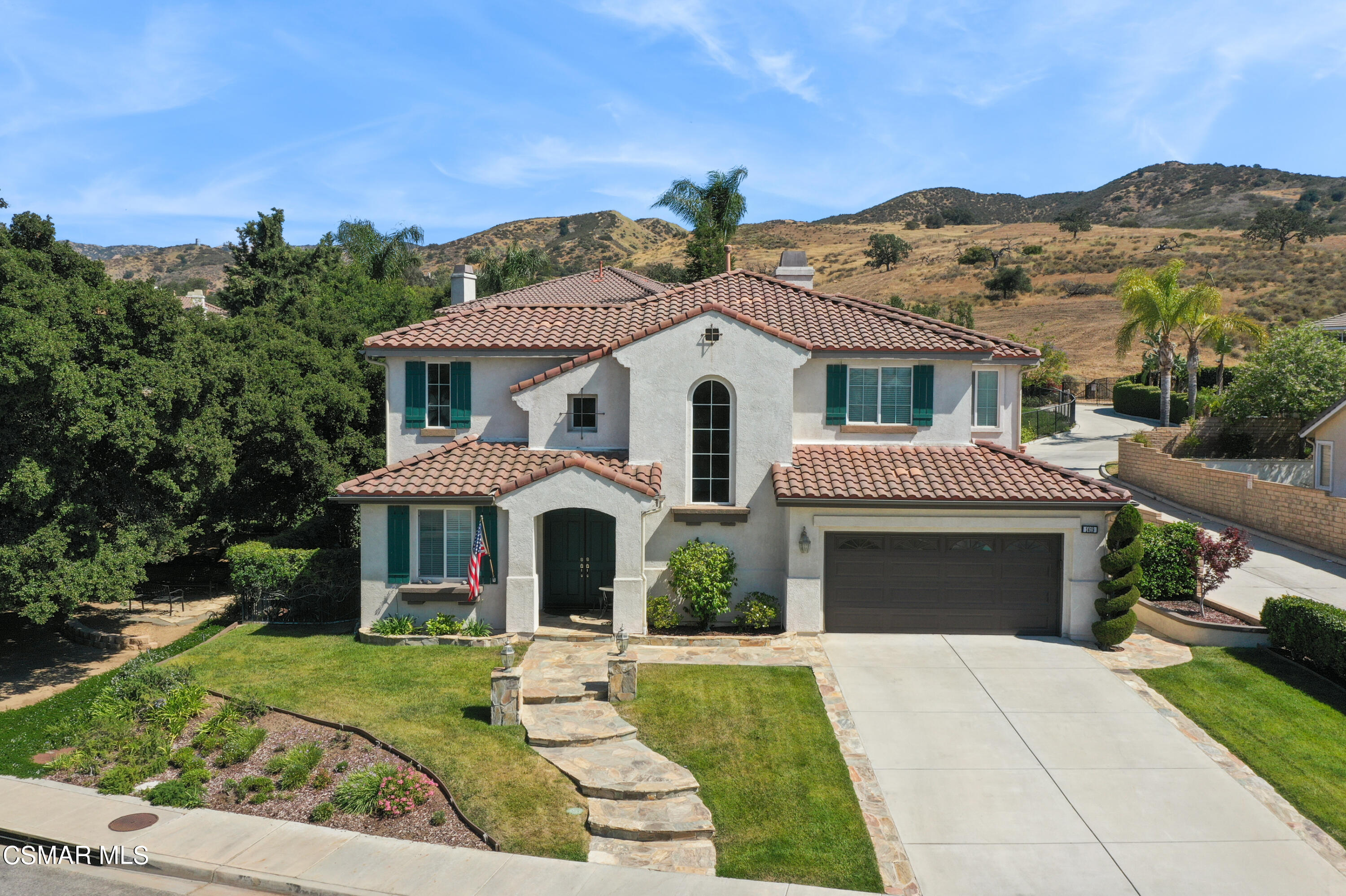 1419 Hidden Ranch Drive Simi Valley, CA 93063 - Photo 2 of 50 a front view of a house with a yard