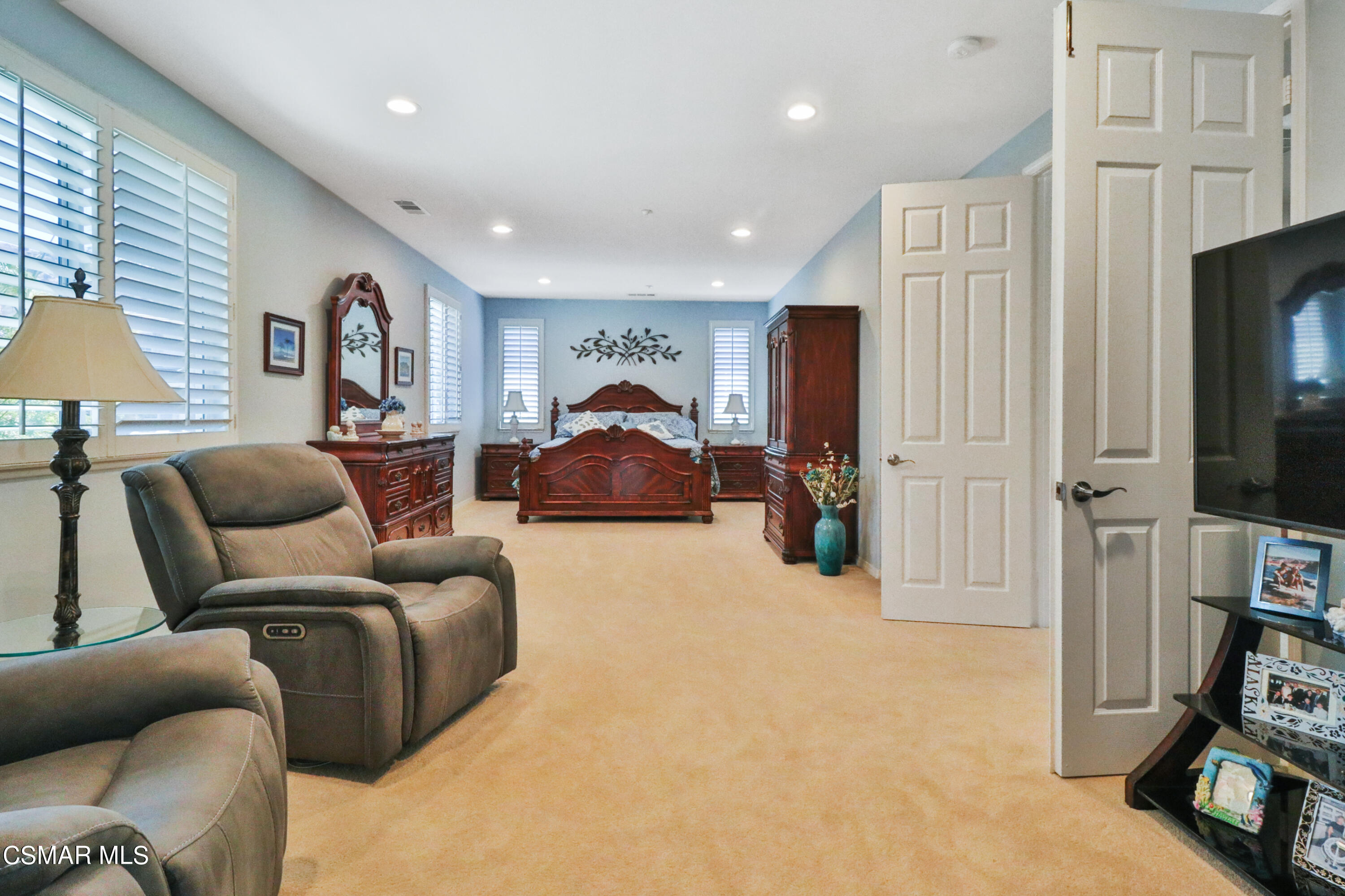 1419 Hidden Ranch Drive Simi Valley, CA 93063 - Photo 32 of 50 a living room with furniture a flat screen tv and a refrigerator