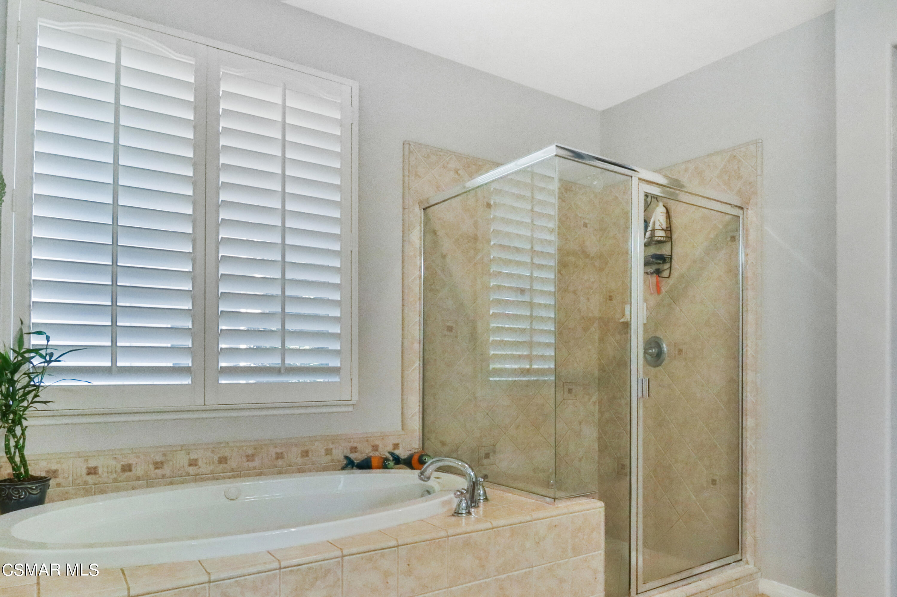 1419 Hidden Ranch Drive Simi Valley, CA 93063 - Photo 36 of 50 a bathroom with a bathtub and shower