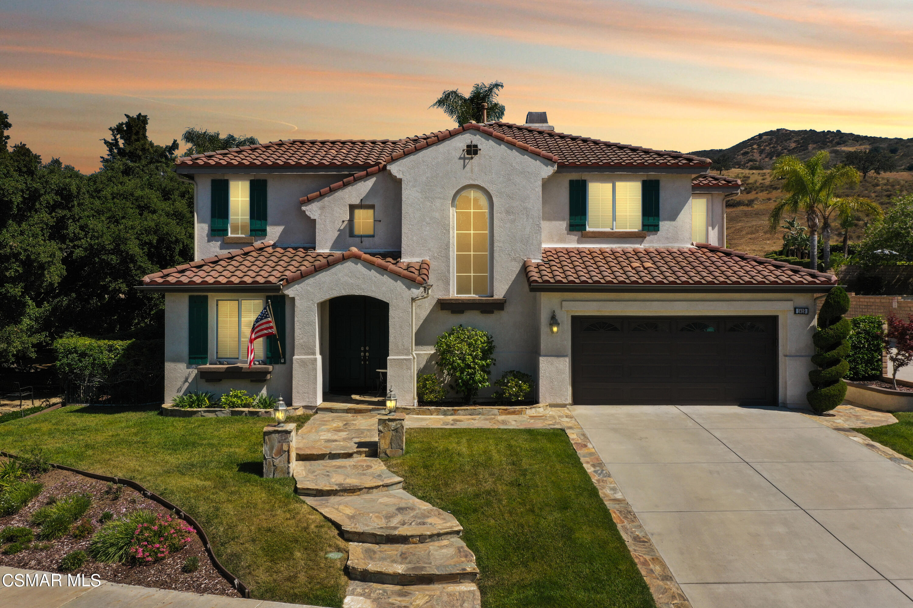 1419 Hidden Ranch Drive Simi Valley, CA 93063 - Photo 4 of 50 a front view of a house with a yard and garage