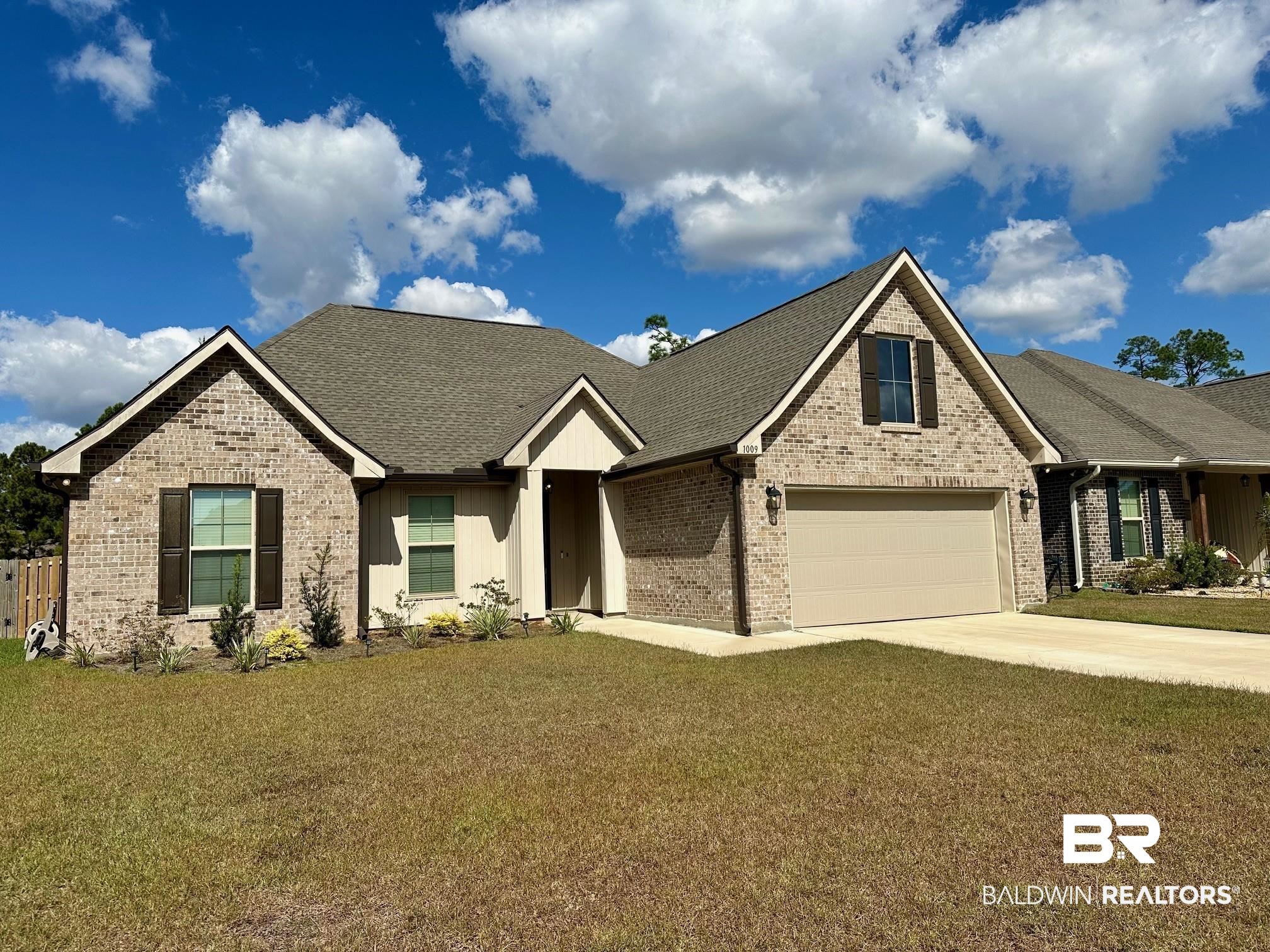 1009 Ruisseau Drive Foley, AL 36535 - Photo 4 of 55 Craftsman inspired home featuring a front yard and a garage