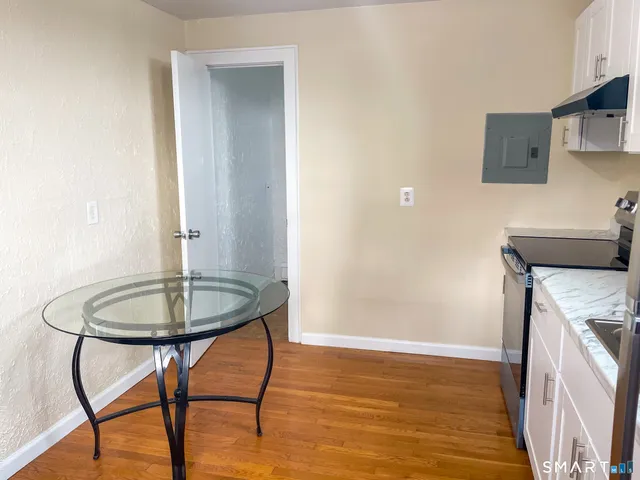 a room with a table and chairs