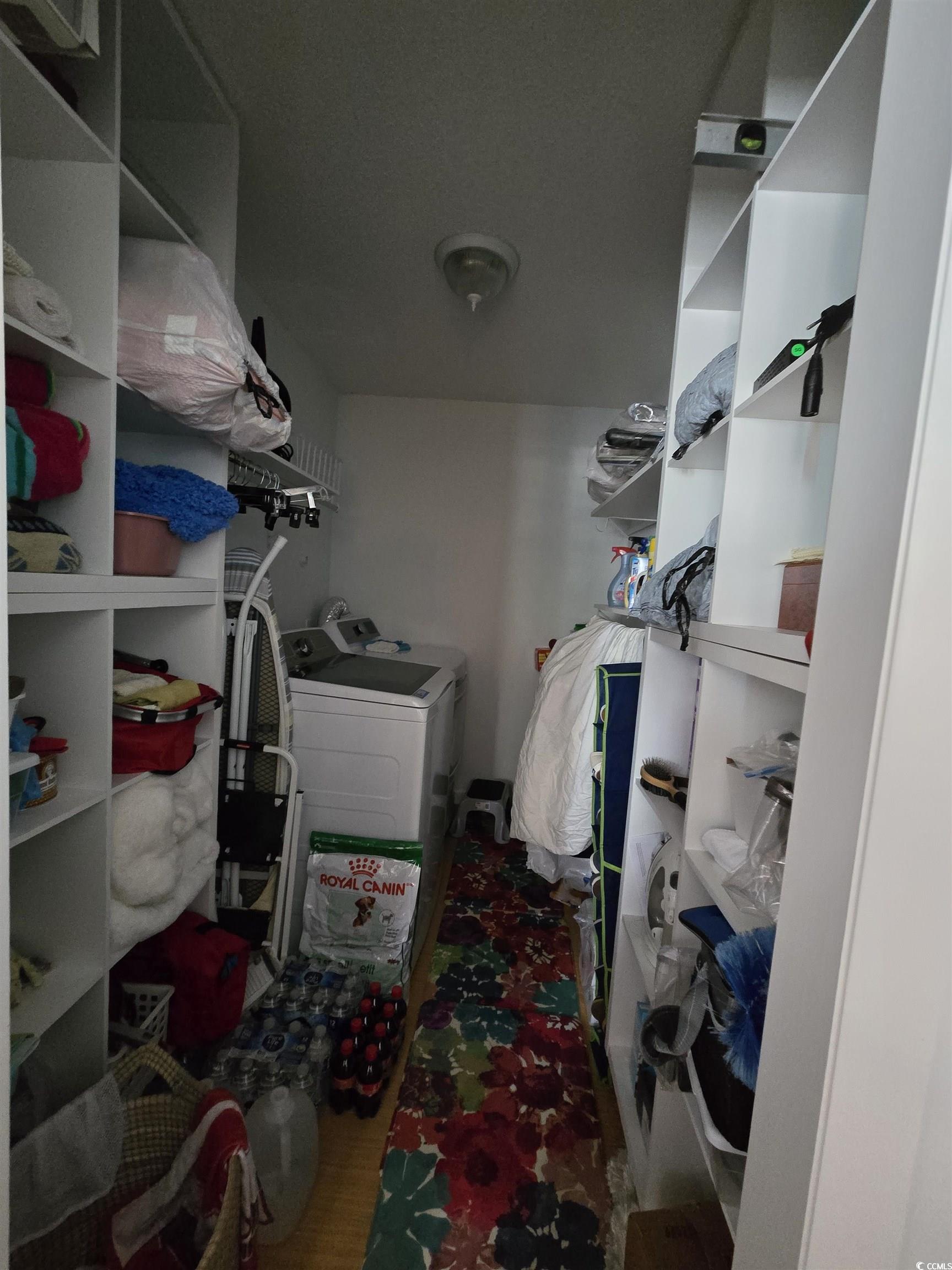 5001 Little River Road, Unit E108 Myrtle Beach, SC 29577 - Photo 15 of 25 Walk in closet with washer and clothes dryer