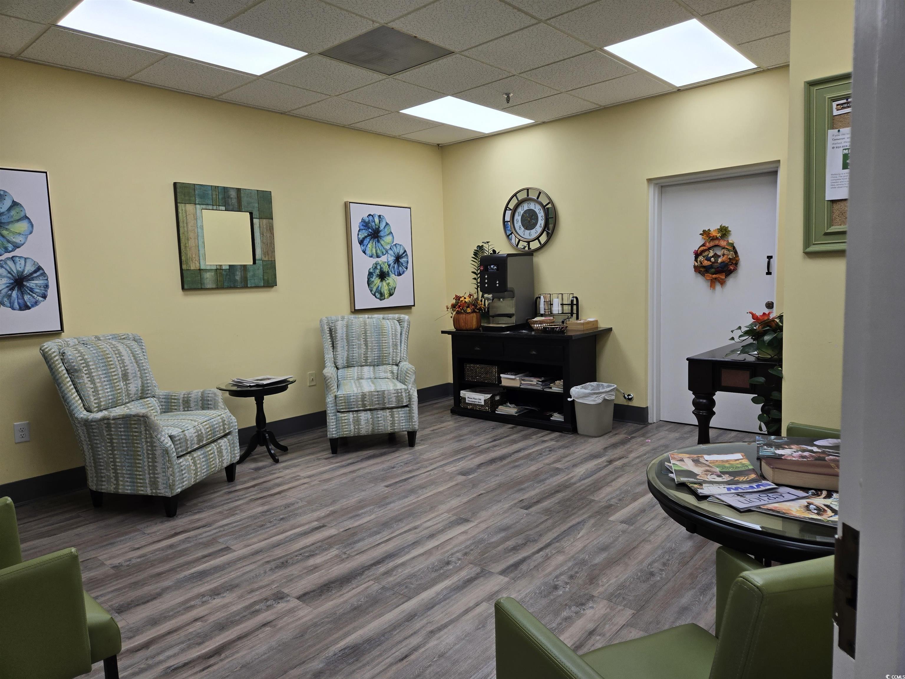 5001 Little River Road, Unit E108 Myrtle Beach, SC 29577 - Photo 17 of 25 Sitting room with dark wood-style floors and a paneled ceiling