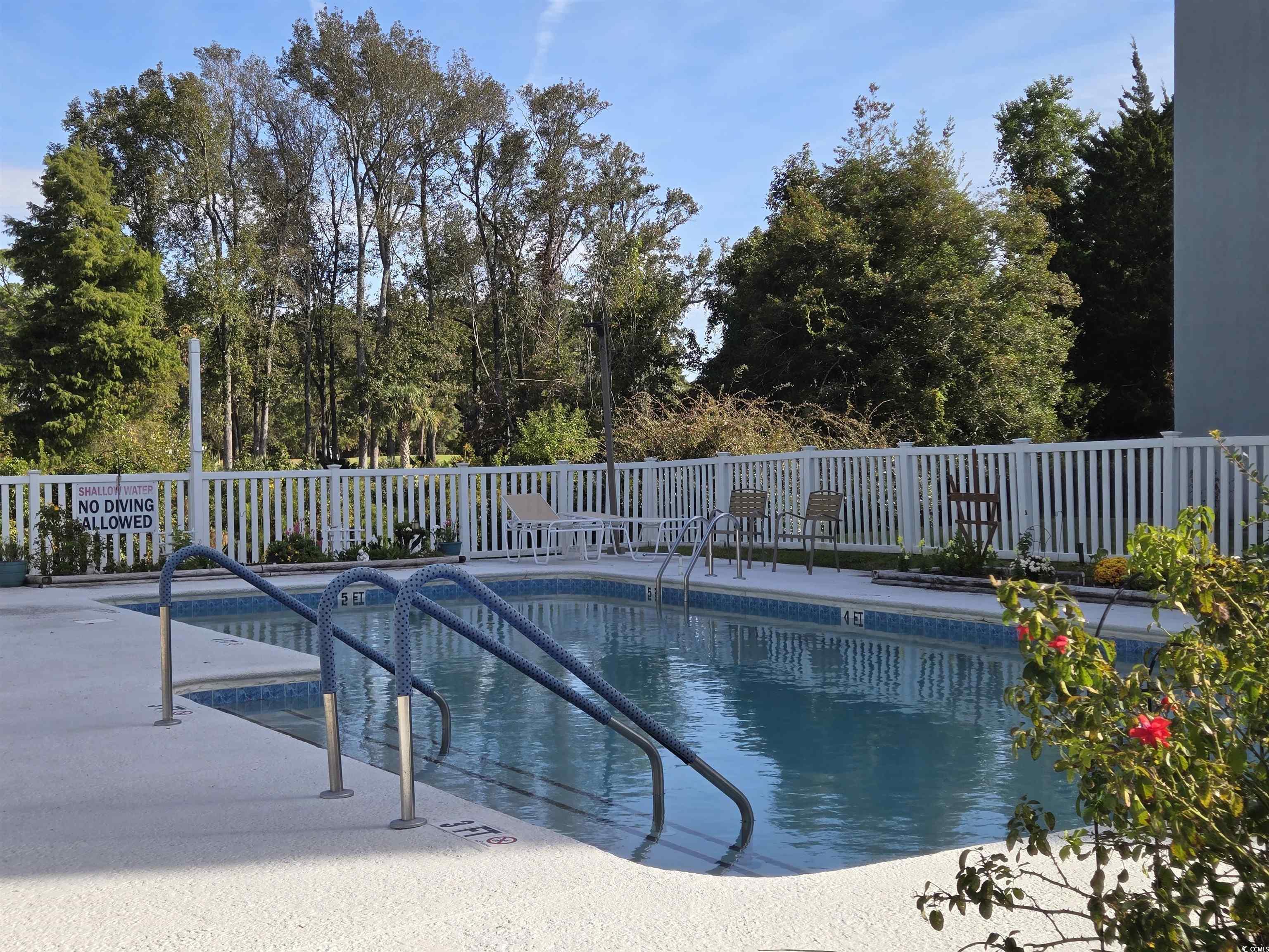 5001 Little River Road, Unit E108 Myrtle Beach, SC 29577 - Photo 22 of 25 Community pool featuring a patio area