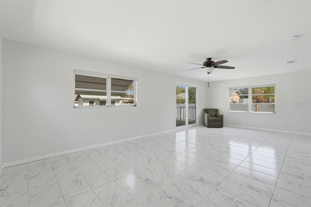 231 North Ridgewood Avenue Ormond Beach, FL 32174 - Photo 13 of 52 a view of an empty room with a window
