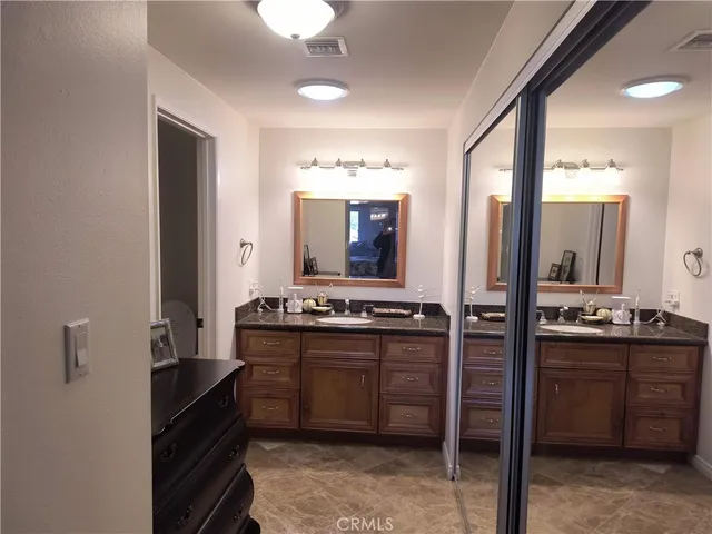 a kitchen with stainless steel appliances granite countertop a stove and a sink