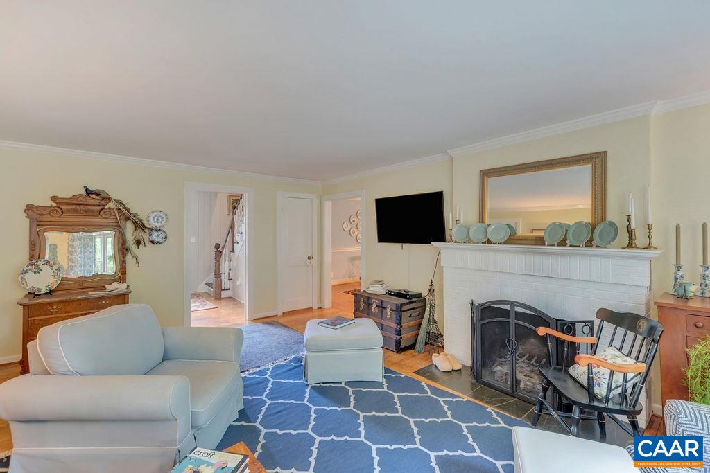 635 Greenwood Road Greenwood, VA 22943 - Photo 13 of 61 a living room with furniture a flat screen tv and a fireplace