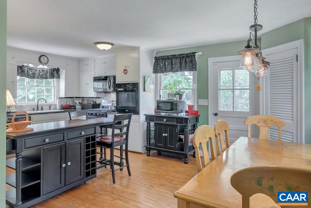 635 Greenwood Road Greenwood, VA 22943 - Photo 21 of 61 a view of a dining room with furniture window and wooden floor