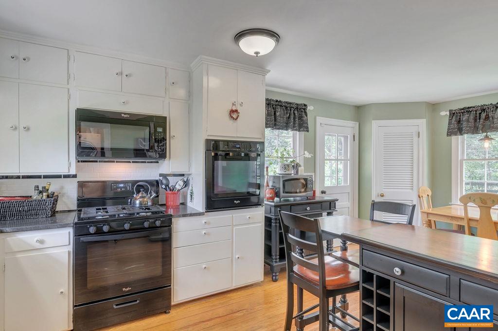 635 Greenwood Road Greenwood, VA 22943 - Photo 25 of 61 a kitchen with a stove a sink and a microwave