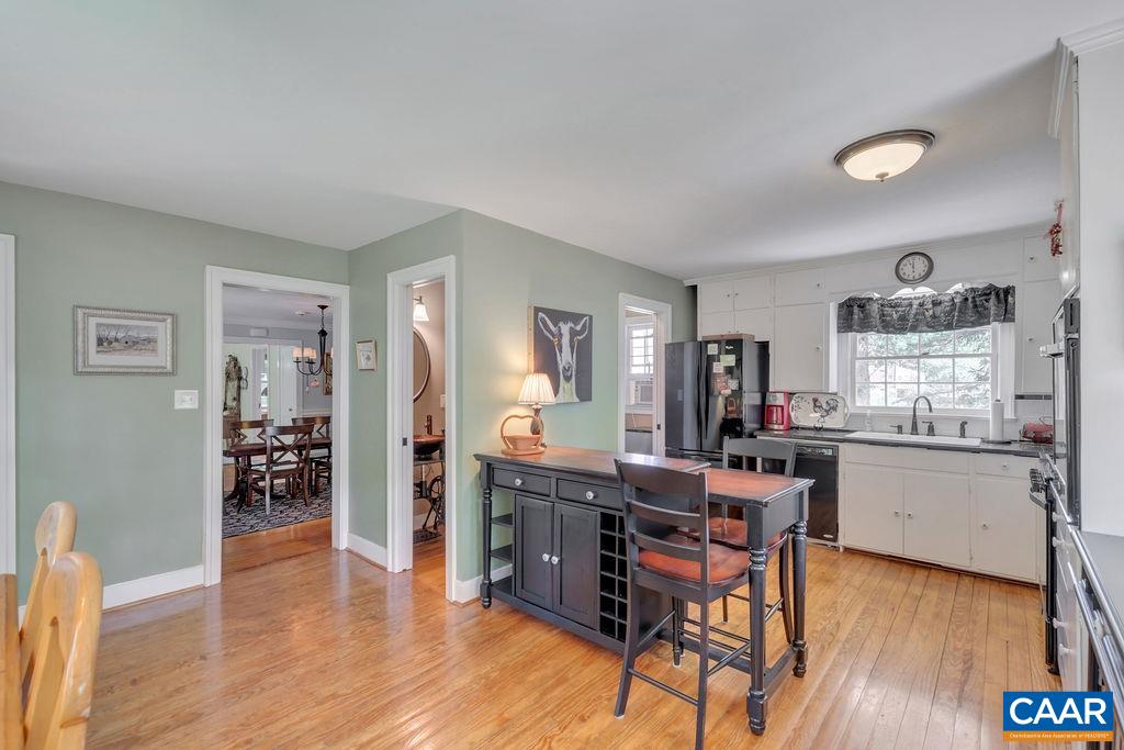 635 Greenwood Road Greenwood, VA 22943 - Photo 27 of 61 a kitchen with stainless steel appliances granite countertop a table and chairs in it