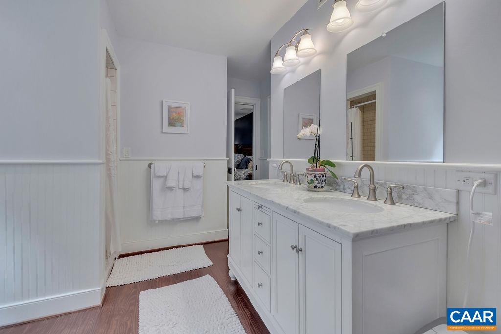 635 Greenwood Road Greenwood, VA 22943 - Photo 32 of 61 a spacious bathroom with a double vanity sink and a mirror