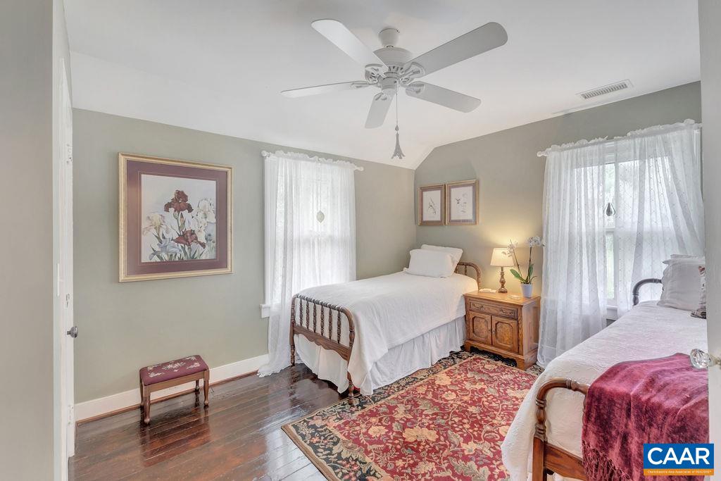 635 Greenwood Road Greenwood, VA 22943 - Photo 36 of 61 a bedroom with a bed and a chandelier