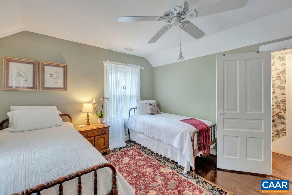 635 Greenwood Road Greenwood, VA 22943 - Photo 39 of 61 a bedroom with a bed and a chandelier