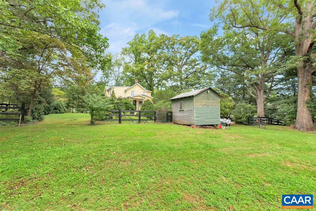 635 Greenwood Road Greenwood, VA 22943 - Photo 46 of 61 a backyard of a house with plants and large trees