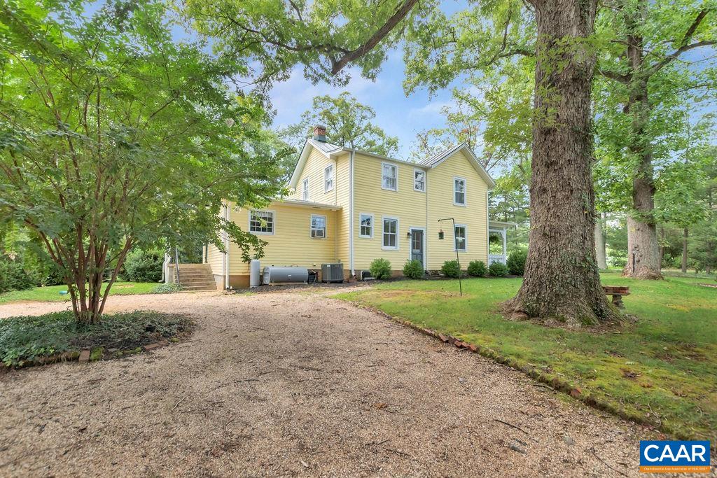 635 Greenwood Road Greenwood, VA 22943 - Photo 5 of 61 a front view of a house with a yard and tree s