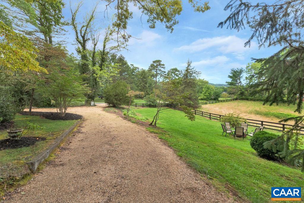635 Greenwood Road Greenwood, VA 22943 - Photo 60 of 61 a view of a lake with a yard and large trees
