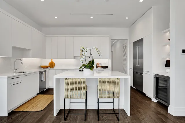 a dining room with furniture and wooden floor