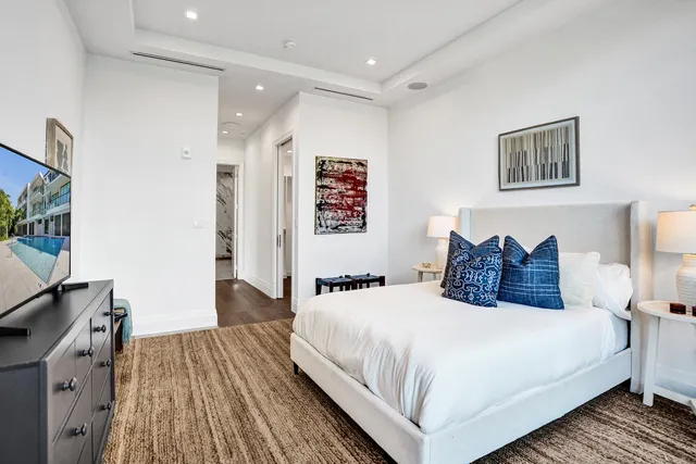 a bed room with two bed and a tv