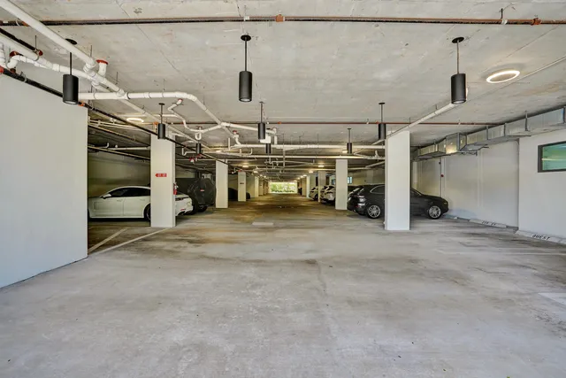 a front view of a building with a garden