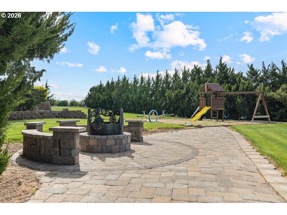 500 St Hilaire Road Yakima, WA 98901 - Photo 25 of 29 a view of a garden with a slide and potted plants