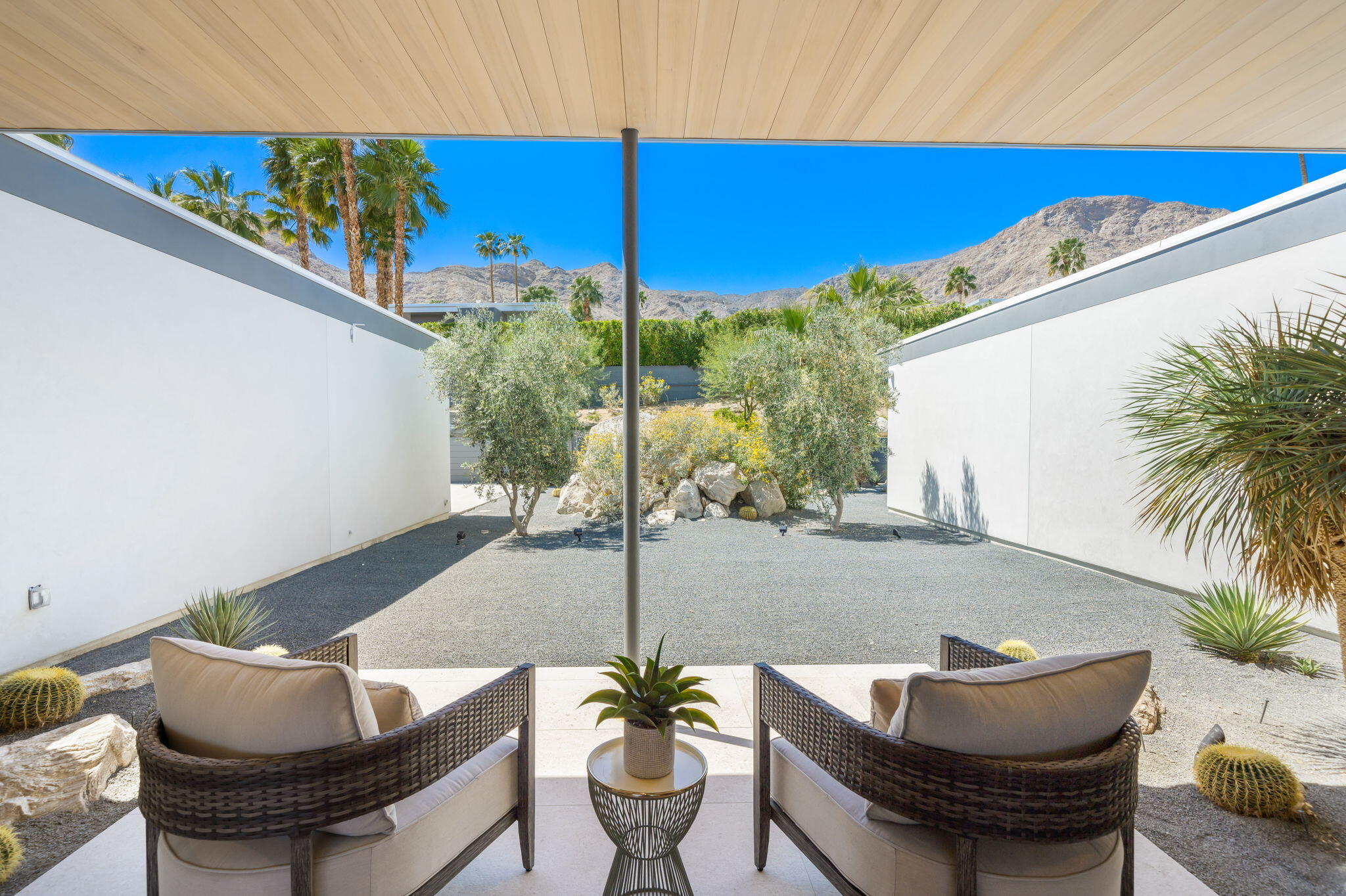 70263 Sonora Road Rancho Mirage, CA 92270 - Photo 46 of 98 a living room with furniture and a potted plant