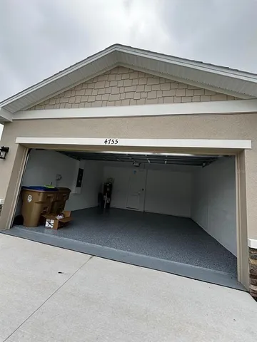 a kitchen with stainless steel appliances a microwave sink and refrigerator