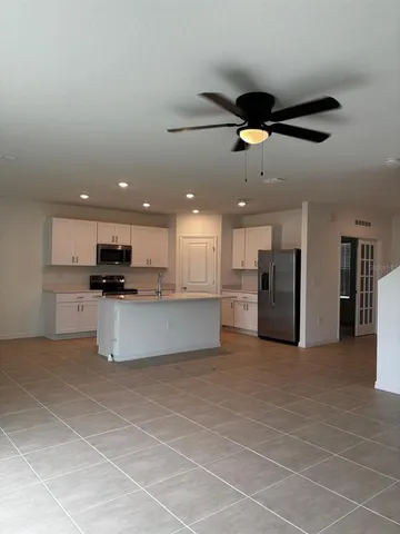 a view of a livingroom and a kitchen