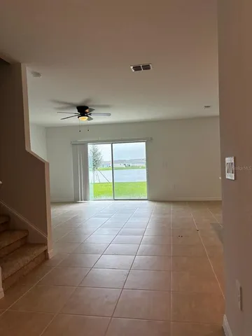 a view of a kitchen with white cabinets