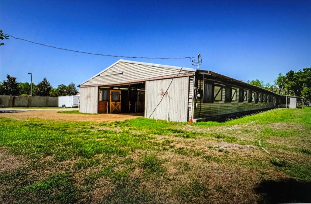 10502 Henderson Road Tampa, FL 33625 - Photo 3 of 16 a view of a house with a yard