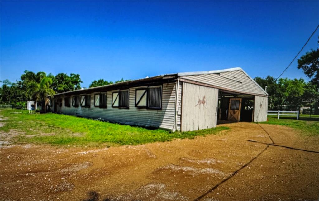 10502 Henderson Road Tampa, FL 33625 - Photo 5 of 16 a front view of a house with a garden and yard
