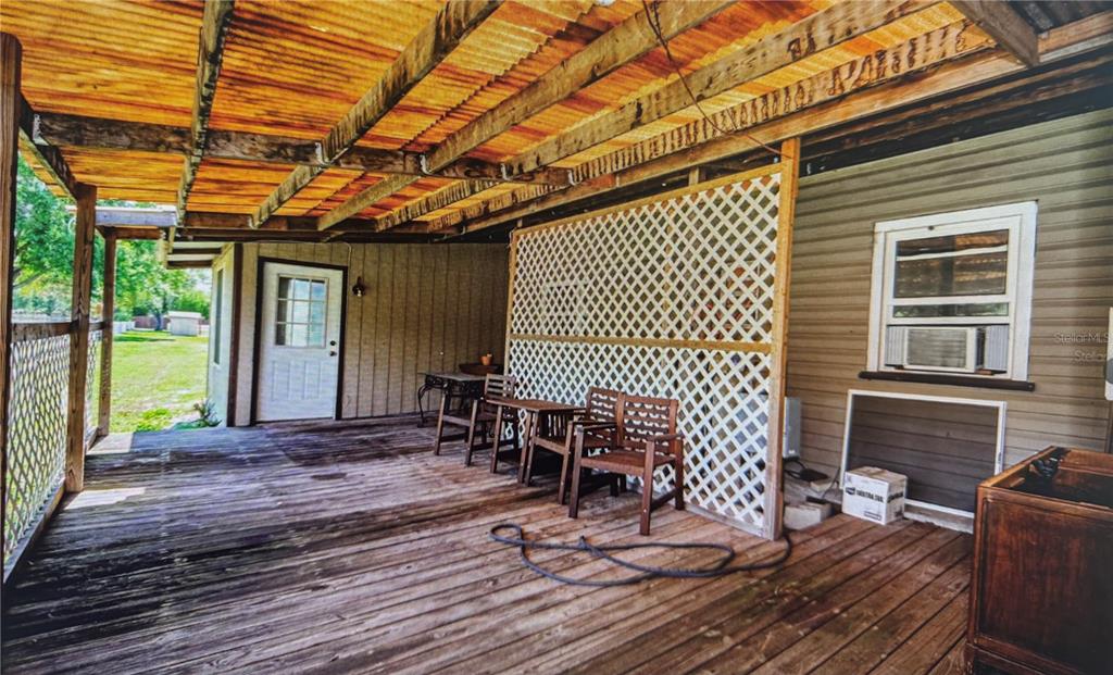 10502 Henderson Road Tampa, FL 33625 - Photo 7 of 16 a view of a lounge chairs in the porch
