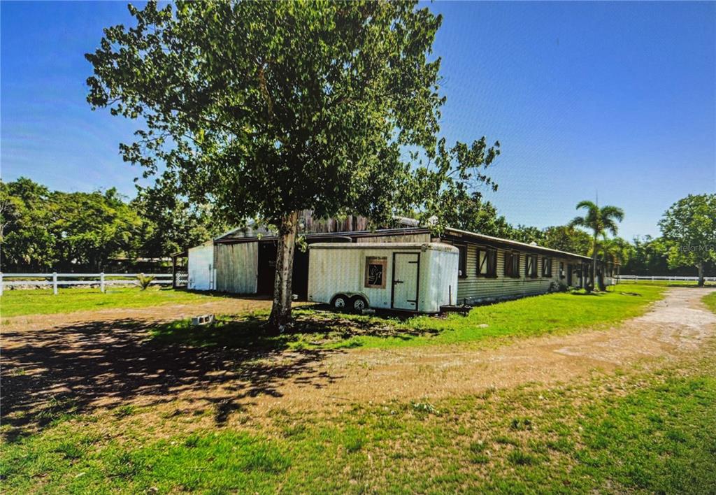 10502 Henderson Road Tampa, FL 33625 - Photo 8 of 16 a view of a house with swimming pool and yard