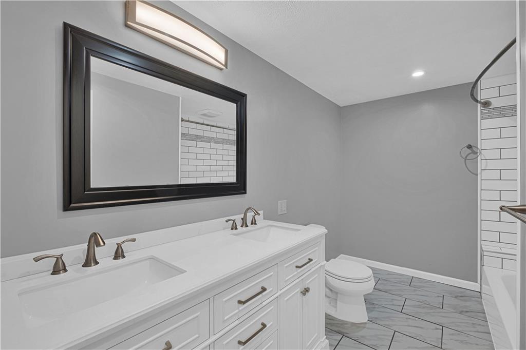 122 Fulton Road Canonsburg, PA 15317 - Photo 14 of 25 a bathroom with a toilet sink and mirror