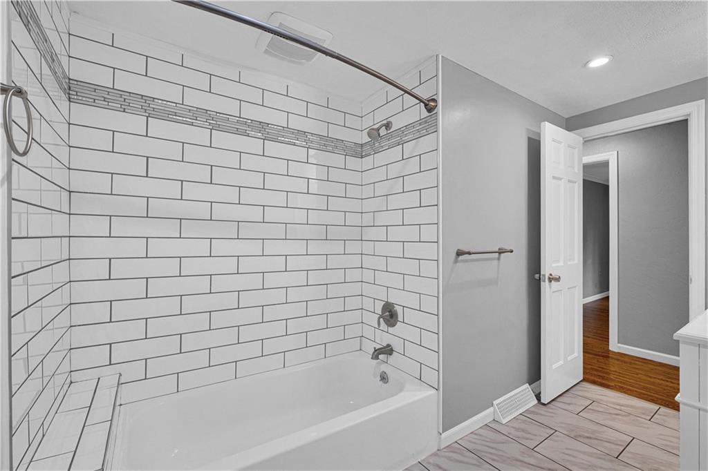 122 Fulton Road Canonsburg, PA 15317 - Photo 15 of 25 a bathroom with a bathtub and a shower