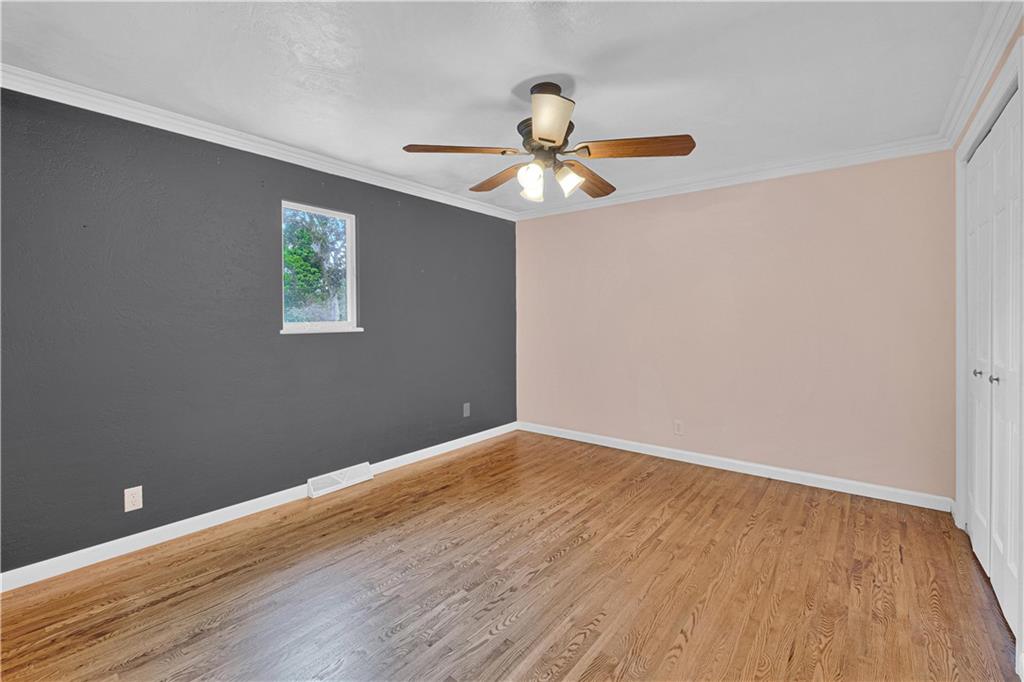 122 Fulton Road Canonsburg, PA 15317 - Photo 16 of 25 a view of an empty room with wooden floor and a ceiling fan