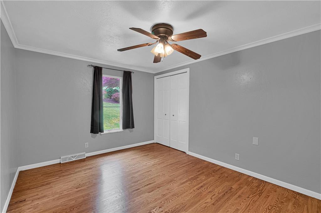 122 Fulton Road Canonsburg, PA 15317 - Photo 17 of 25 a view of an empty room with window and wooden floor