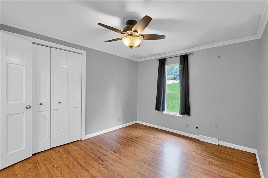 122 Fulton Road Canonsburg, PA 15317 - Photo 18 of 25 a view of an empty room with window and wooden floor