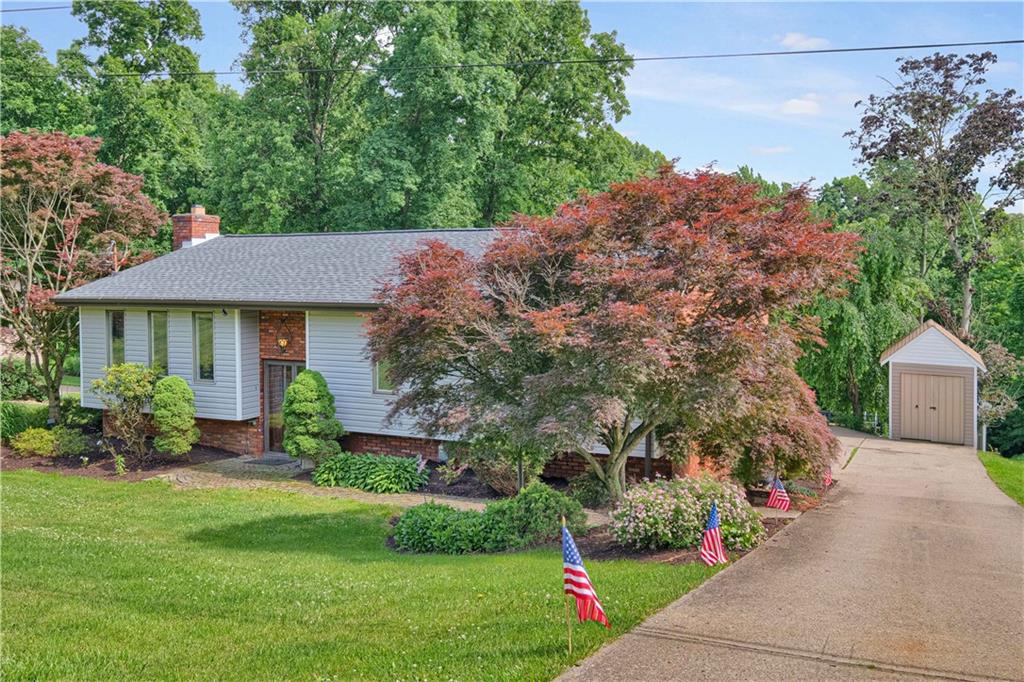 122 Fulton Road Canonsburg, PA 15317 - Photo 2 of 25 a front view of a house with garden