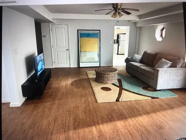 a view of a dining room with furniture and window