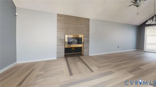 a living room with furniture and flowers