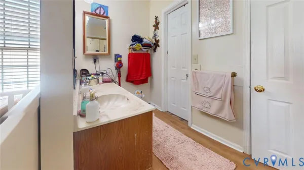 a view of a room that has a bed and a window
