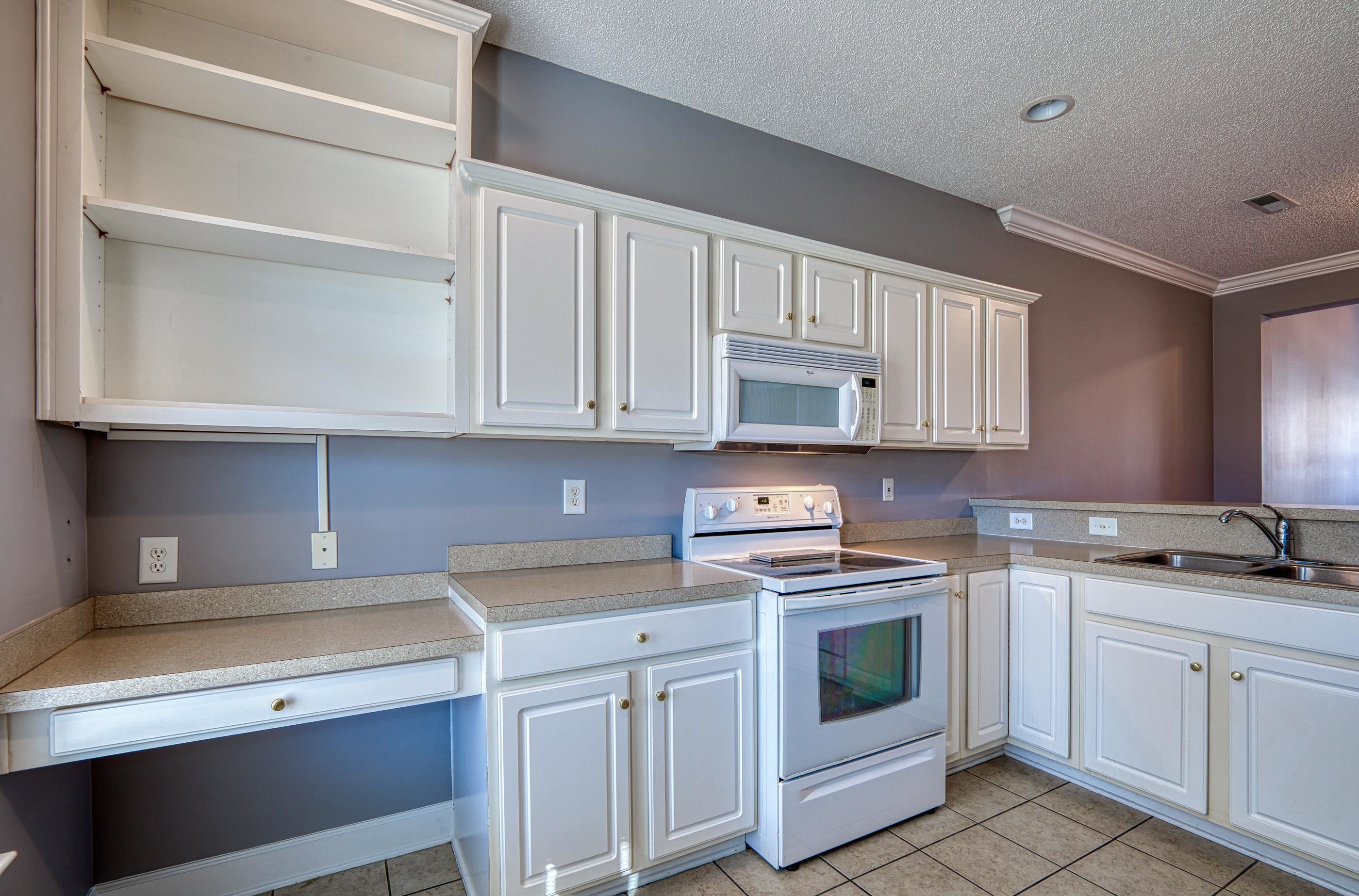 205 Threshing Way, Unit 1050 Myrtle Beach, SC 29579 - Photo 12 of 40 Kitchen featuring white appliances, white cabinetry, light countertops, open shelves, and a textured ceiling