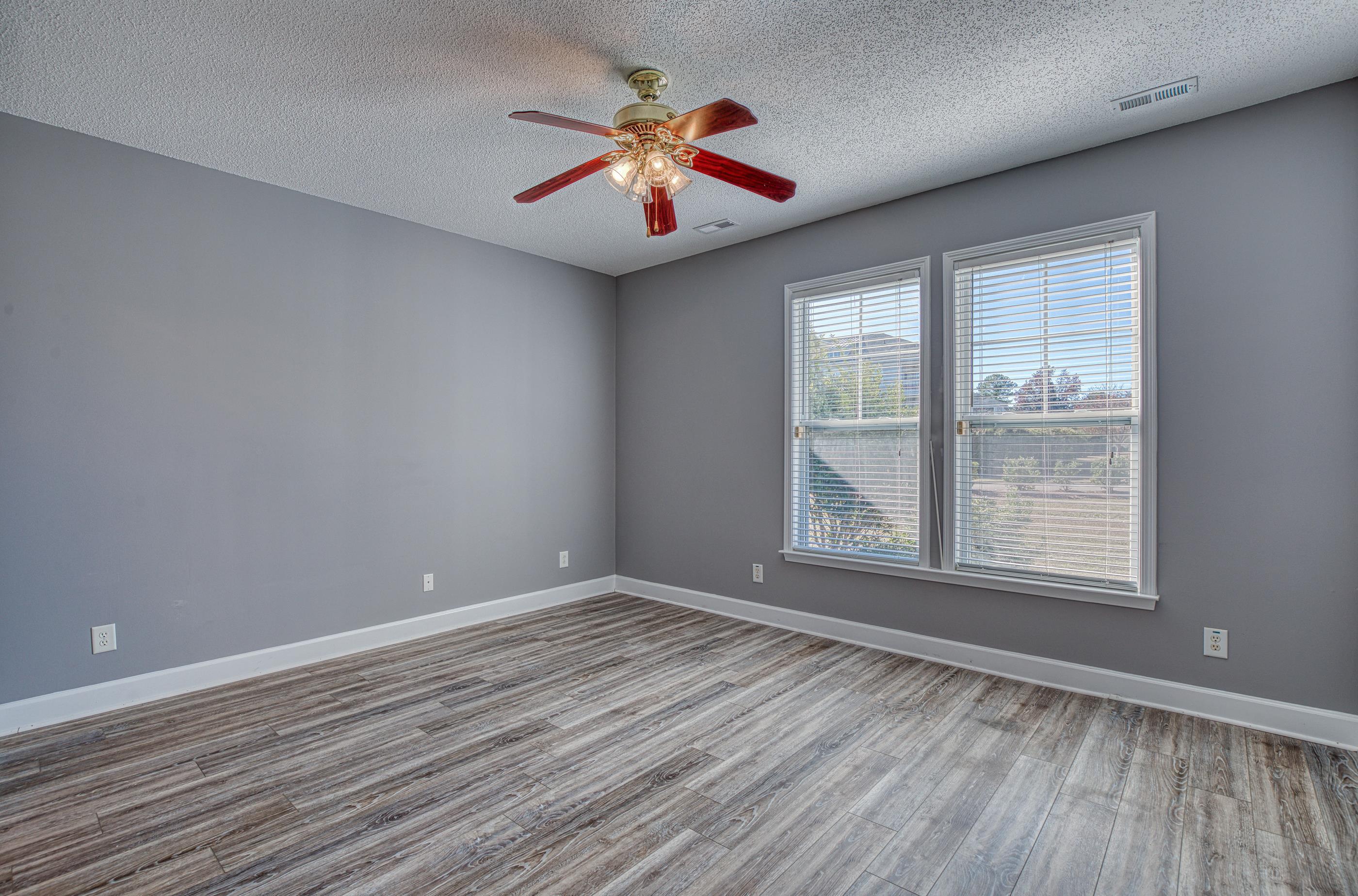 205 Threshing Way, Unit 1050 Myrtle Beach, SC 29579 - Photo 16 of 40 Unfurnished room with a textured ceiling, light wood-type flooring, and a ceiling fan
