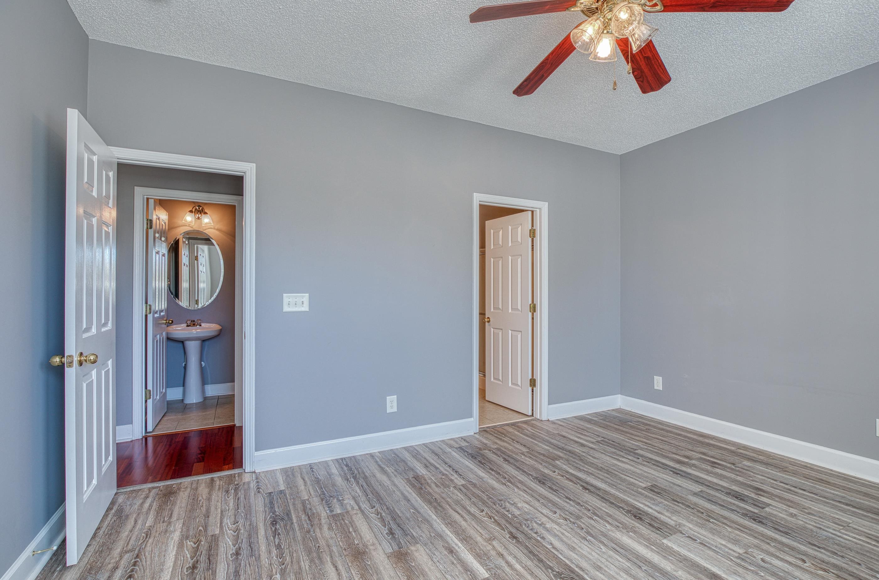 205 Threshing Way, Unit 1050 Myrtle Beach, SC 29579 - Photo 17 of 40 Unfurnished bedroom with a textured ceiling, light wood-style floors, and ceiling fan