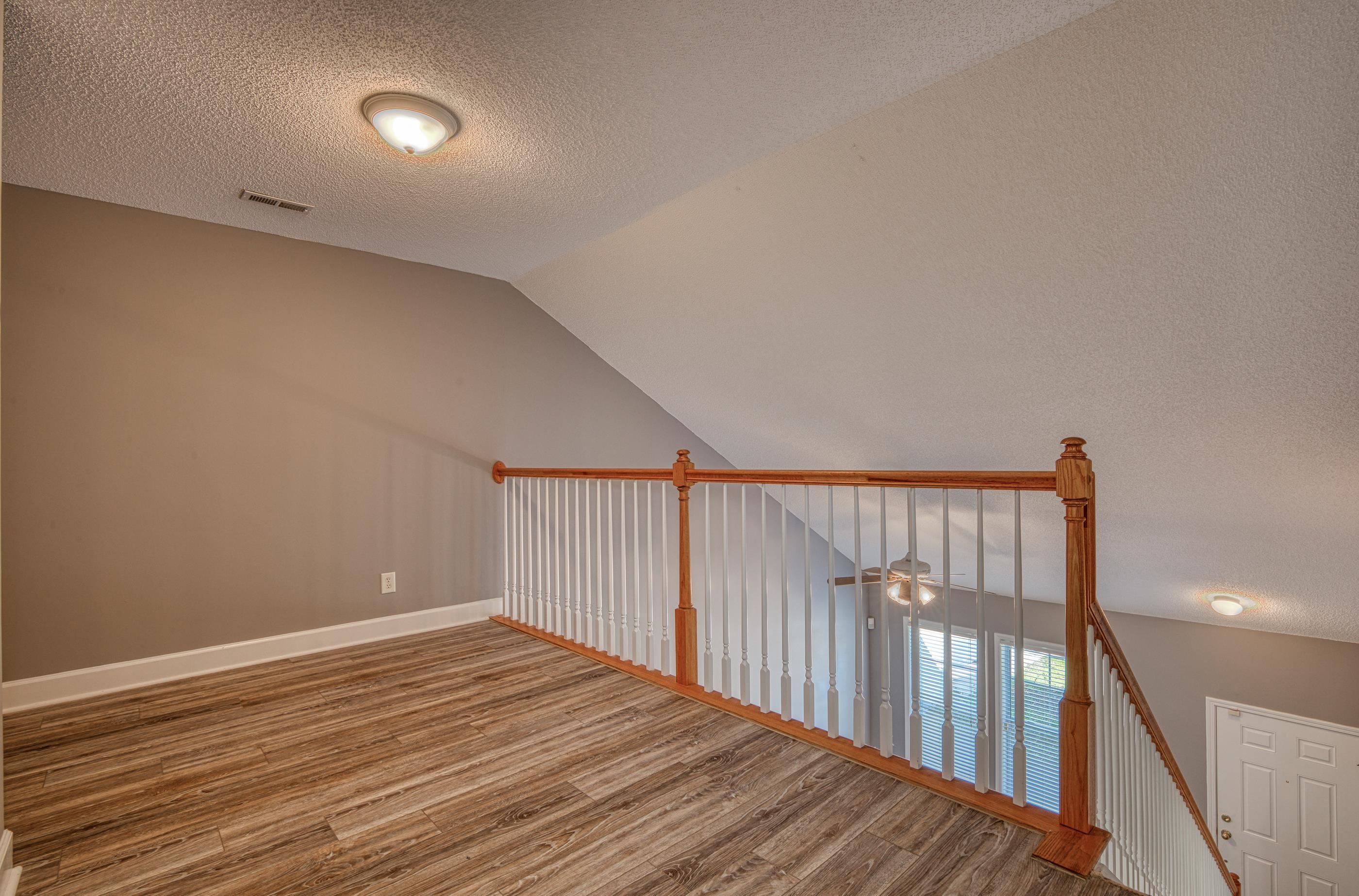 205 Threshing Way, Unit 1050 Myrtle Beach, SC 29579 - Photo 24 of 40 Additional living space with a textured ceiling, light wood-style flooring, vaulted ceiling, and ceiling fan
