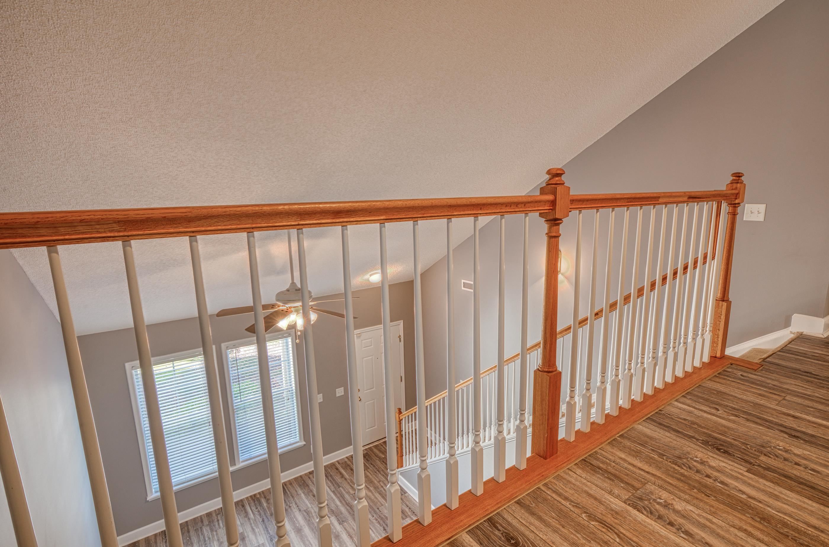205 Threshing Way, Unit 1050 Myrtle Beach, SC 29579 - Photo 25 of 40 Staircase with wood finished floors, ceiling fan, and a textured ceiling