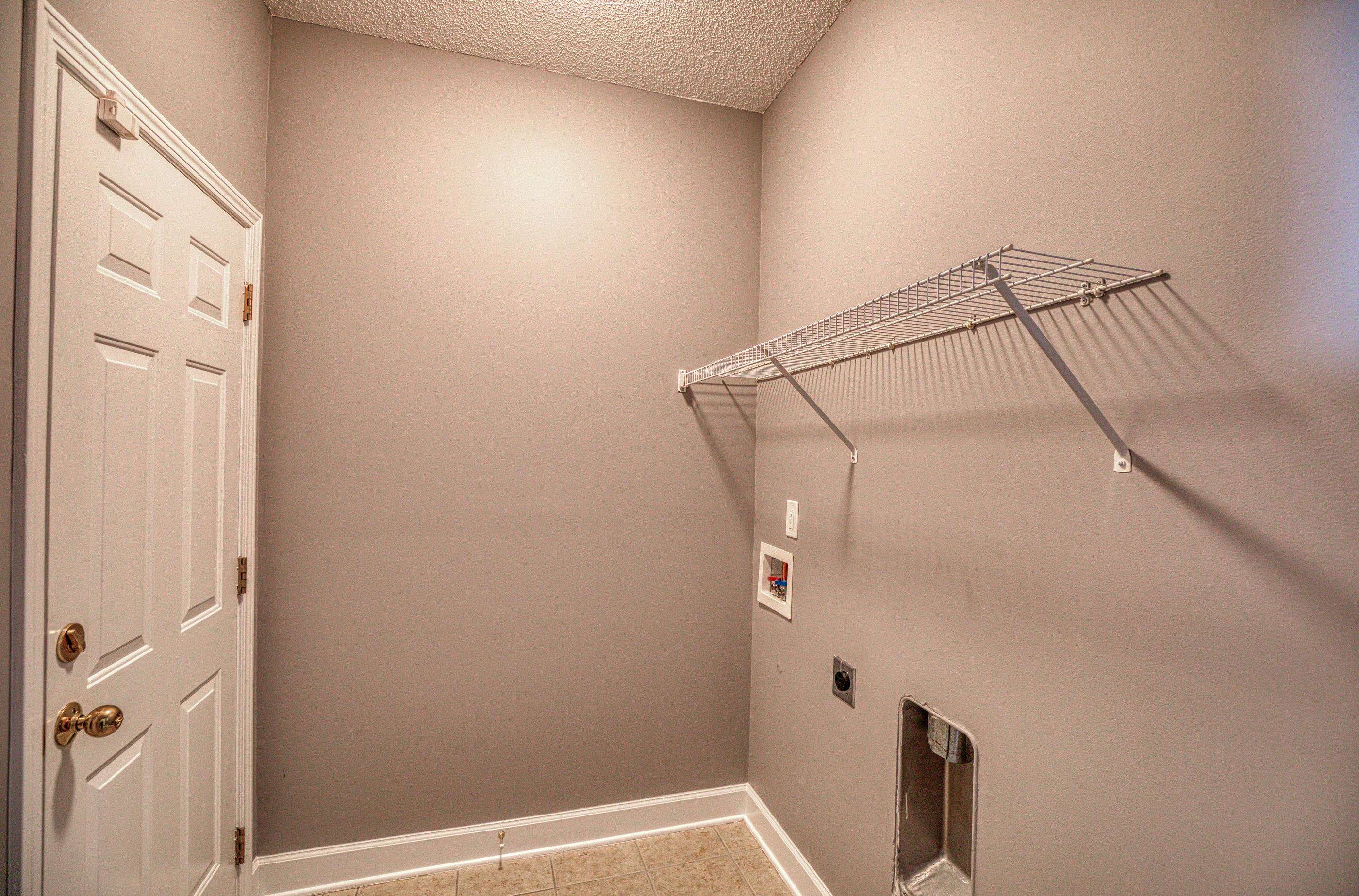 205 Threshing Way, Unit 1050 Myrtle Beach, SC 29579 - Photo 33 of 40 Laundry room with hookup for a washing machine, a textured ceiling, and hookup for an electric dryer