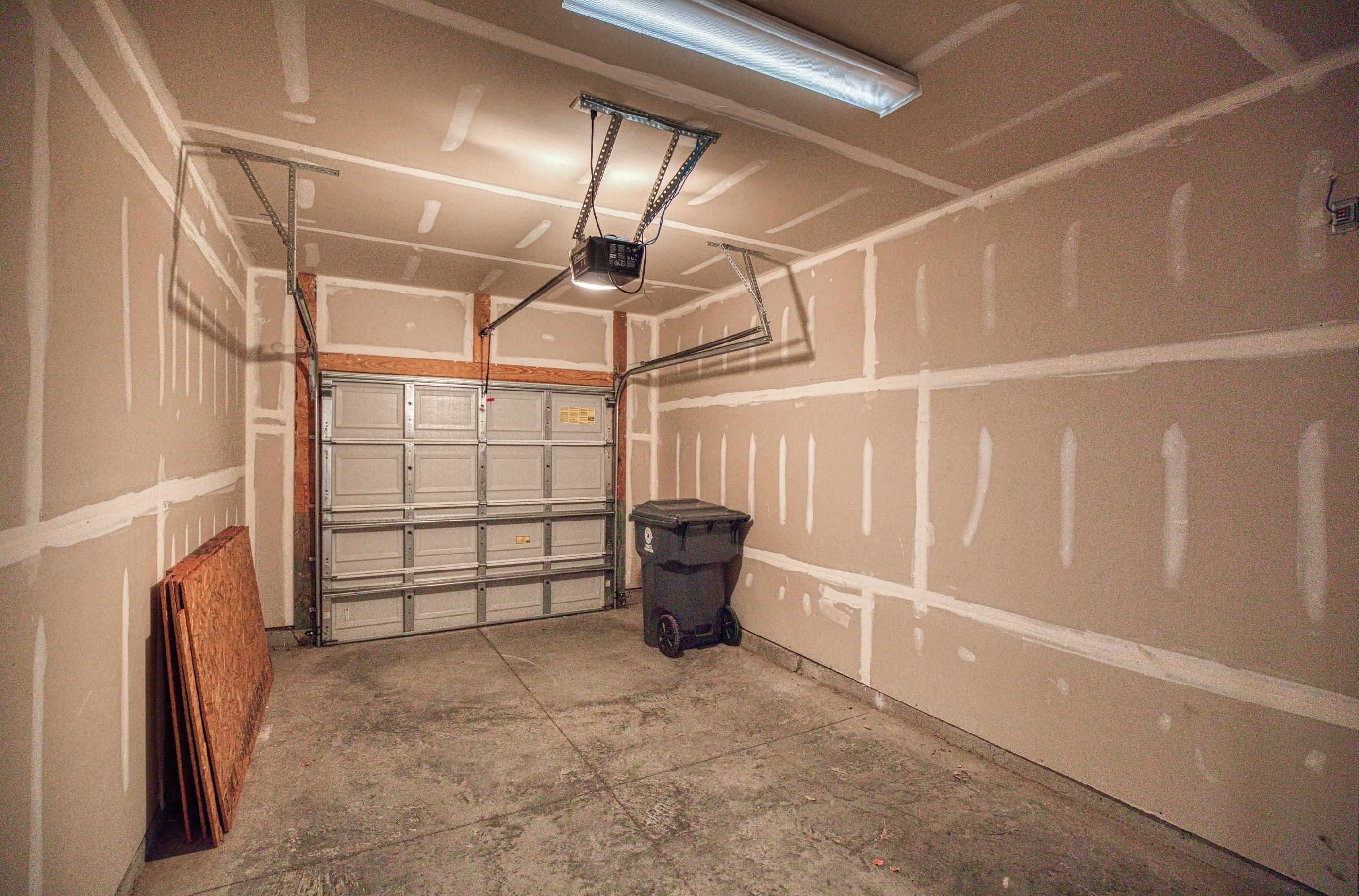 205 Threshing Way, Unit 1050 Myrtle Beach, SC 29579 - Photo 34 of 40 Garage featuring a garage door opener